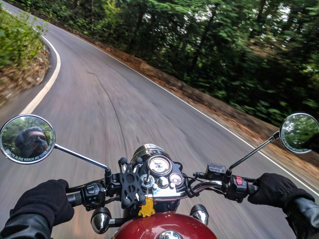 motorcycle navigating a turn with no roadside barriers