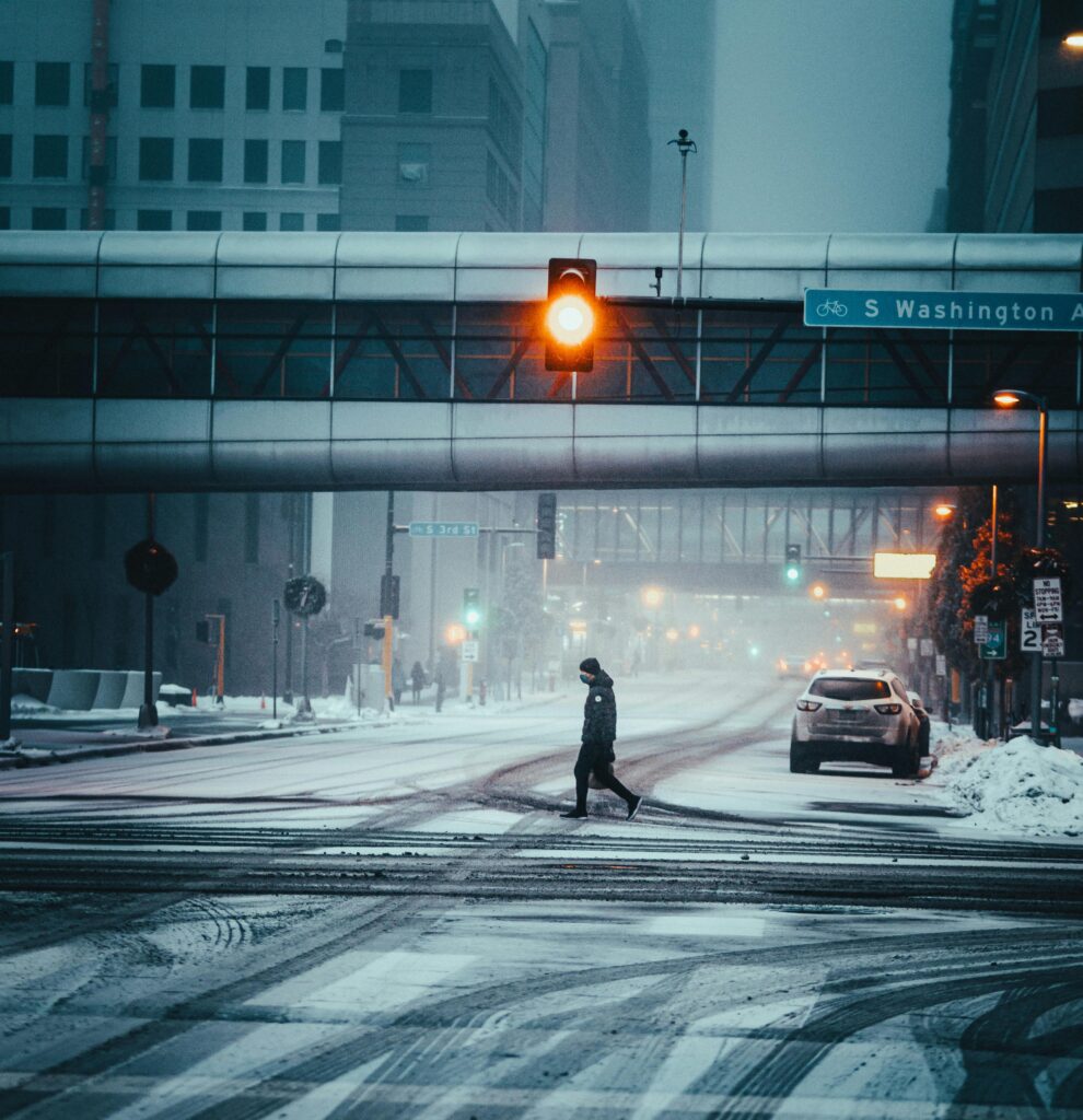 smart city traffic light above a snowy intersection